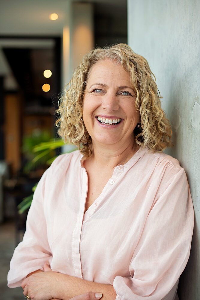 Portrait photograph of a person, shown beside a founder and director profile